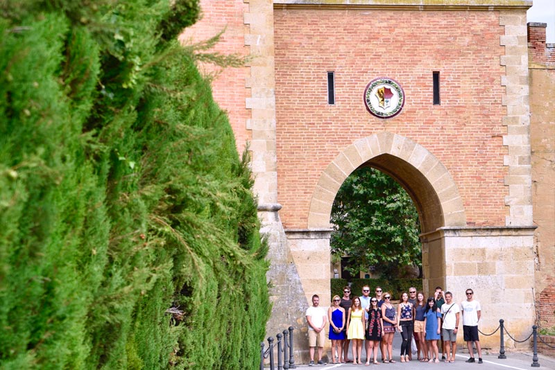 Bolgheri Food & Wine Tour Food tour guests in front of Castle in Bolgheri