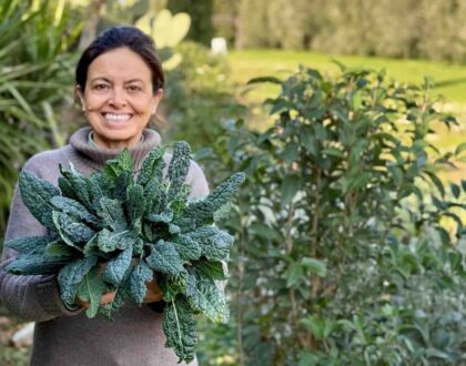 Chicca at Winter garden harvest in Tuscany with fresh herbs and greens